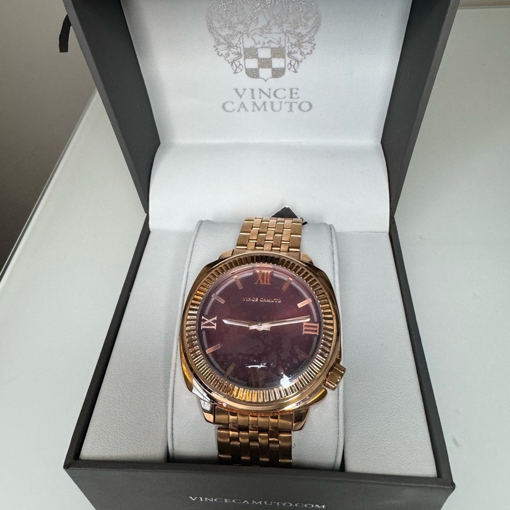 Vince Camuto Gold Bracelet Watch with Deep Red Dial and Roman numerals.